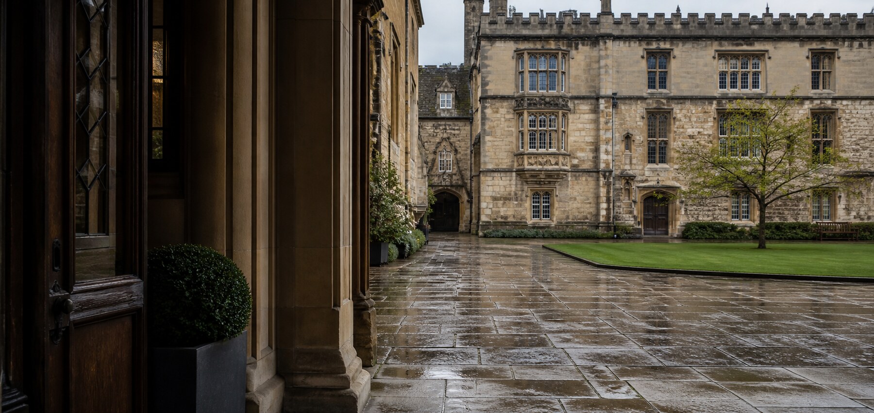 Rain falling across an Oxford quadrangle